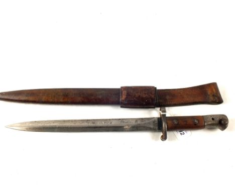 An Enfield model 1903 bayonet with Mk 2 scabbard and frog.  Blade marked with all correct stamps including issue date 2/05