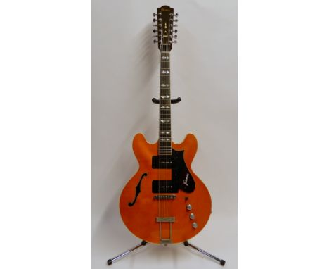 A Framus 12 string electric guitar in burnt orange with faux f-holes, with a damaged guitar case (2)The above lot is from the