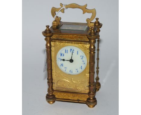 A brass carriage clock with in travel case, 12cm high Condition Report: Available upon request