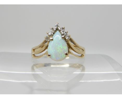 A 14k gold opal and diamond ring size M1/2, weight 2.8gms Condition Report: Available upon request