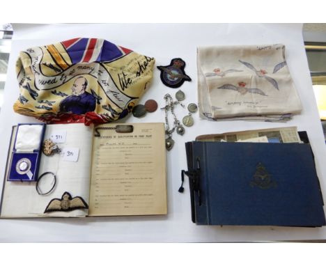 A lot comprising a pilot's log book, W B Millar, 1943-44, two albums of related photographs, a patch, cap badge, dog tags, tw