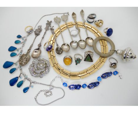 Silver rings, costume jewellery white metal spoons and a teething rattle Condition Report: No condition report available