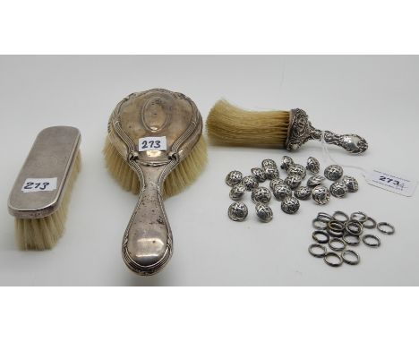 A lot comprising two silver backed brushes, a silver crumb brush, London 1910 and a quantity of livery buttons (4) Condition 