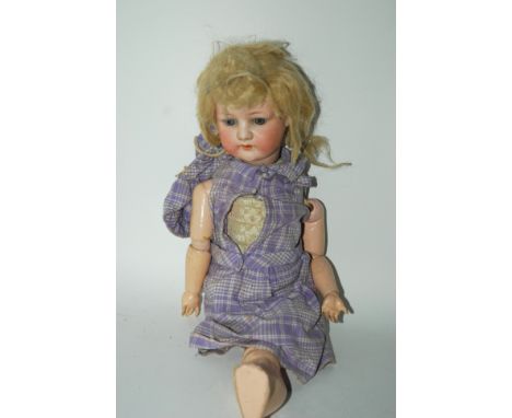 A German bisque-headed doll, another doll etc Condition Report: Available upon request