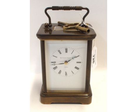 A Matthew Norman brass cased carriage clock with numbers 1750 to back Condition Report: Has key but does not wind.