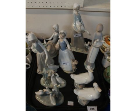 A collection of Nao figures including Goose Girls, a Lladro figure and one other figure Condition Report: Two figures broken.