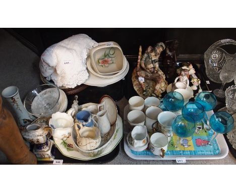A Capodimonte group of a man on a bench, assorted commemorative mugs, drinking glasses etc Condition Report: Available upon r