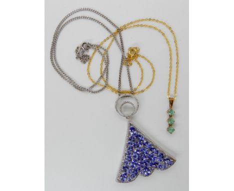 A 9ct gold emerald pendant, with gold plated chain, together with a silver tanzanite and diamond accent pendant and chain Con