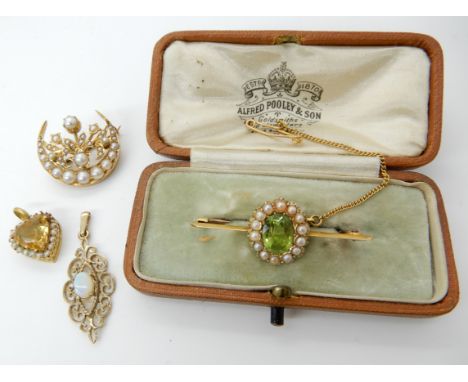 A 15ct gold peridot and pearl brooch, dimensions 3.7cm x 1.3cm, weight 2.7gms a pearl set bright yellow metal crescent moon b