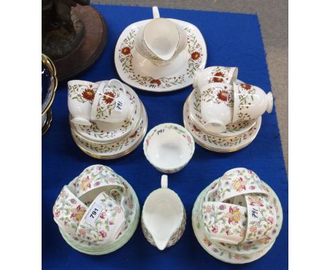 A Minton Haddon Hall teaset comprising six cups, saucers and plates, milk jug and sugar bowl, together with a Susie Cooper Ma