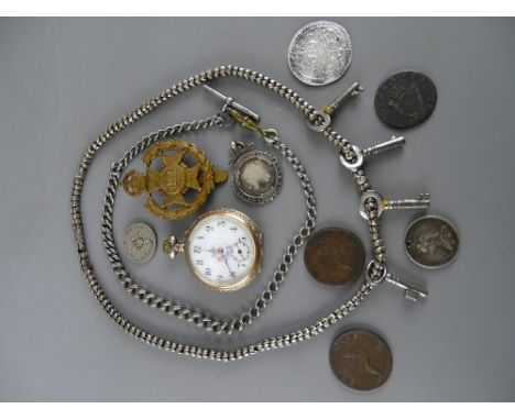 Vintage pocket watch with decorative dial, a silver Albert with T-bar, a selection of badges and coins including an OBS Carli