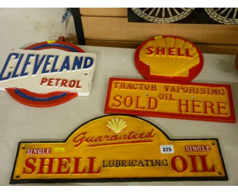 Two Shell oil and one Cleveland petrol vintage style advertising signs