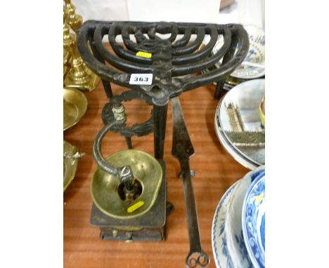 Two cast iron trivets, an antique brass and long handled iron pan with a vintage cast coffee grinder