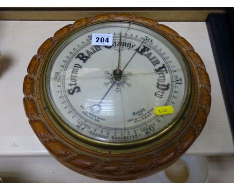 Oak framed aneroid barometer (glass cracked)