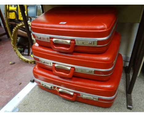 Graduating set of three vintage Spartanite travel cases in vibrant red