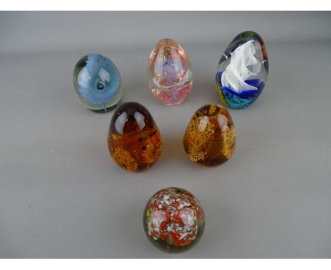 Six vintage standing paperweights having bubble and swirl inclusion