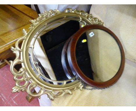 Vintage mahogany framed oval wall mirror and a fancy mid Century gilt example