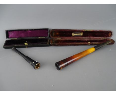 Two cased vintage cheroot/cigarette holders
