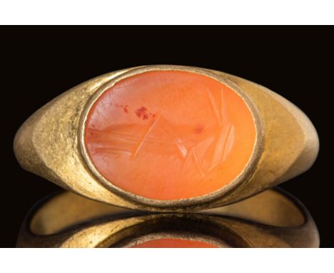Ca. AD 100 - 300.An oval-shaped carnelian stone intaglio depicting a grasshopper with an elongated body, bent hind legs and o