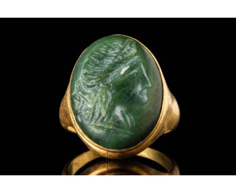 Ca. 200 - 100 BC. A green stone convex intaglio depicting Venus in profile, facing right. The figure’s facial features are de