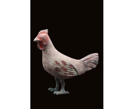 Ca. 202 BC - AD 220. A terracotta rooster with a hollow body and a naturalistic stance. The head is detailed with a prominent