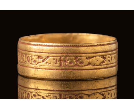 Ca. AD 1802.A 21ct gold mourning ring by Matthew Govett, London, with an outer face engraved ‘BENJ: DENMAN OB 31 JAN 1803 AE 