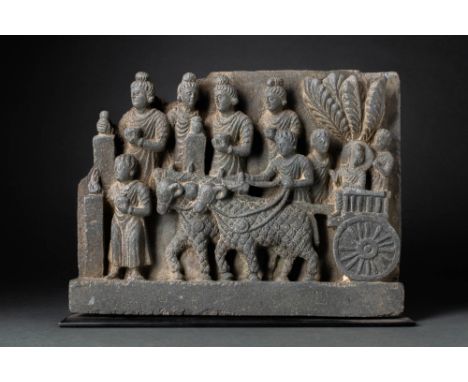 Ca. AD 200 - 400. A carved schist panel depicting the young prince, Siddhartha, going to school in a cart and accompanied by 