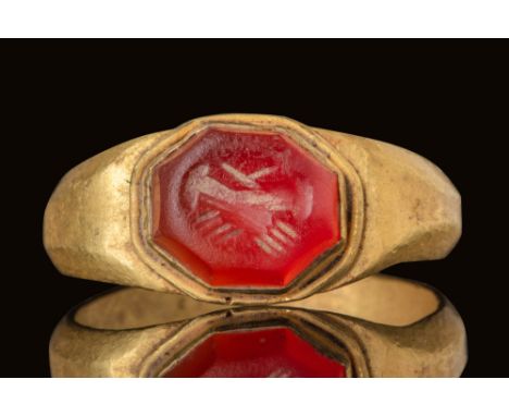 Ca. AD 100 - 300.A red intaglio with an octagonal shape engraved with a pair of clasped hands - dextrarum iunctio, a symbol o