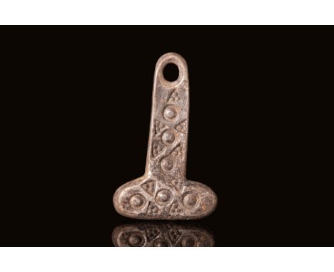 Ca. AD 800 - 1100. A silver pendant in the form of Thor's hammer, Mjolnir, a symbol of strength and power in Norse mythology.