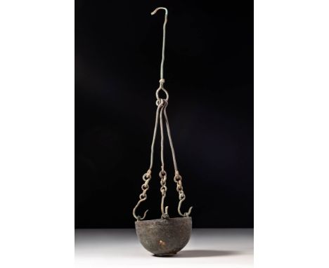 Ca. AD 400 - 600. A bronze censer with a hemispherical bowl incised on the exterior with horizontal bands. The bowl rests on 