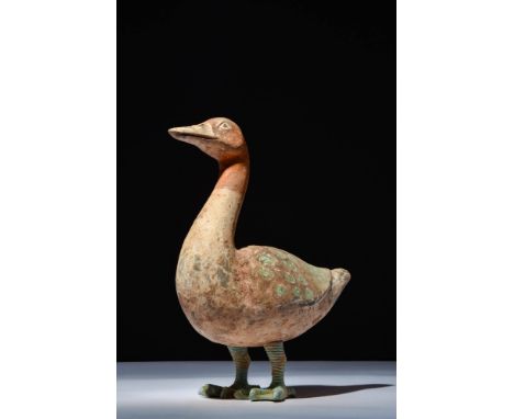 Ca. 202 BC - AD 220. A terracotta goose with an elongated neck curving gracefully upward. The head features slightly recessed