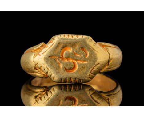 Ca. AD 800 - 1000. A gold ring with a hexagonal bezel engraved with a stylised Sri symbol, associated with prosperity. The sy