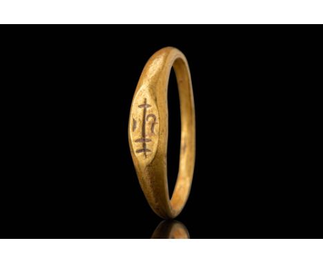 Ca. AD 600 - 900.A gold ring with a flat, narrow bezel engraved with an ankusha symbol, a stylised representation of an eleph