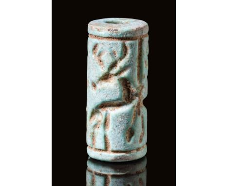 Ca. 14th - 13th century BC. A composite cylinder seal depicting two deer flanking two columns with starry elements. Studied b