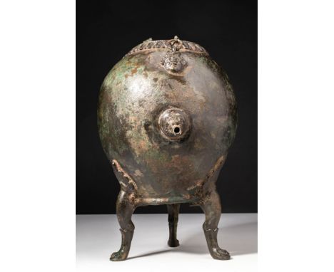 Ca. AD 1 - 200. A bronze authepsa, an ancient portable water-heating vessel. The oval-shaped body is supported by three legs 