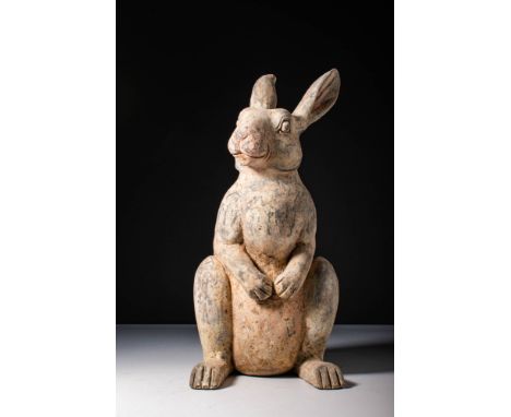 Ca. 202 BC - AD 220. A pottery figure of a rabbit seated upright on its hind legs. Large, upright ears display subtle traces 