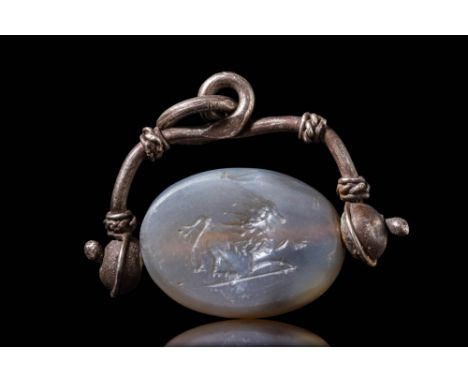 Ca. 3rd - 6th century AD. A cylinder seal depicting a crouching lion, possibly still set in its original bezel ring. Studied 