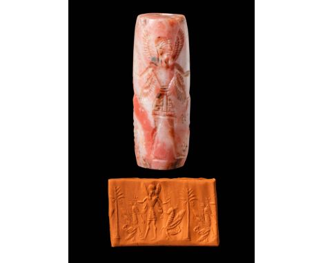 Ca. 9th - 8th century BC . A cylinder seal depicting a four-winged hero holding two mythical creatures, with a life tree (dat