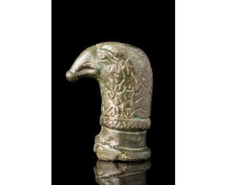 Ca. AD 200 - 400 . A bronze chariot fitting in the form of an eagle's head with a prominent, downward-curving beak that termi