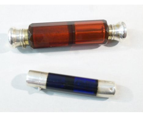 RUBY RED GLASS OCTAGONAL CUT DOUBLE-ENDED SCENT BOTTLE WITH SILVER TOPS C.1890 (L: 12 cm) TOGETHER WITH A BLUE GLASS DOUBLE-E