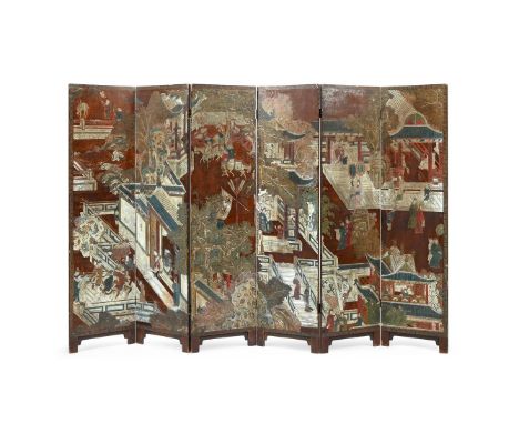 A Chinese six-fold 'Coromandel lacquer' screen, Kangxi period (1662-1722), decorated with a scene of courtly figures within a