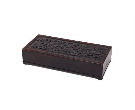 A Chinese carved zitan rectangular bat box and cover, Qing dynasty, supported on four short feet, the cover carved in relief 