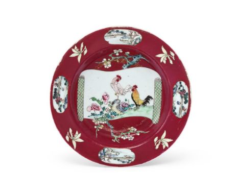 A Chinese Famille Rose ruby-ground bowl, Qing dynasty, Yongzheng period (1723-1735), the deep centre painted with a scroll sh