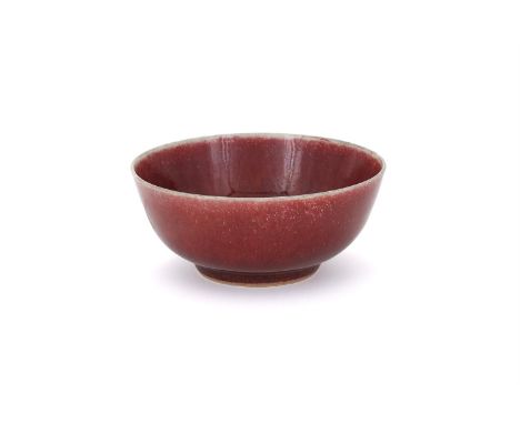 A Chinese Langyao red monochrome bowl, Qing Dynasty, Kangxi, with finely veined glaze pooling to white at the rim, the foot i