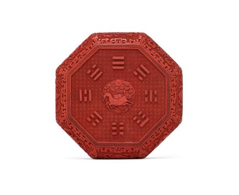 A Chinese cinnabar lacquer 'Eight trigrams' box and cover, 18th or 19th century, of octagonal form, the central roundel cast 