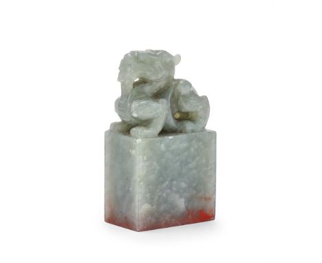 A Chinese jade rectangular seal, 20th century, the finial carved as a recumbent sing horned beast, carved seal face, 7.2cm hi