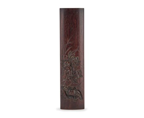 A Chinese carved 'crab and lotus' zitan wrist wrest, Republican, finely carved with a crab resting beneath lotus leaves and f