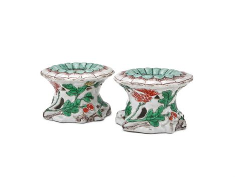 An unusual pair of Chinese Famille Verte salts, Kangxi (1662-1722), the upper surface moulded in the form of a flowerhead pai