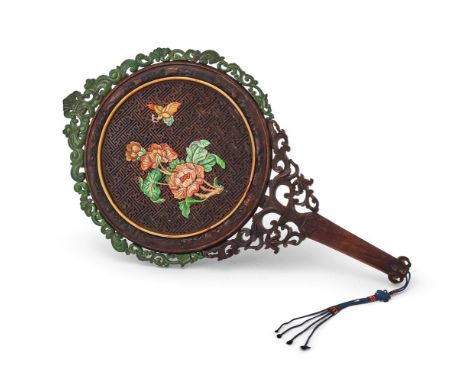 A Chinese carved huanghuali hand mirror, Qing Dynasty, the circular mirror surmounted with openwork stained bone borders, one