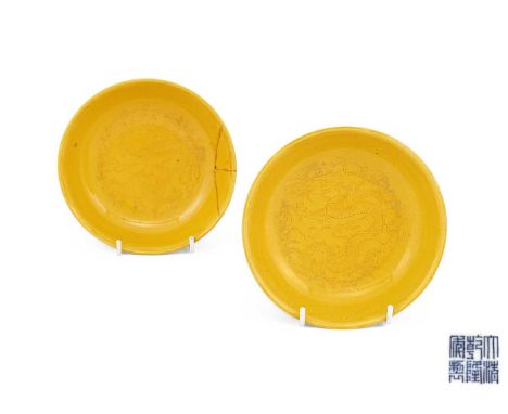 A pair of Chinese yellow-glazed incised 'dragon' saucer dishes, Qianlong seal mark and of the period, incised in the central 